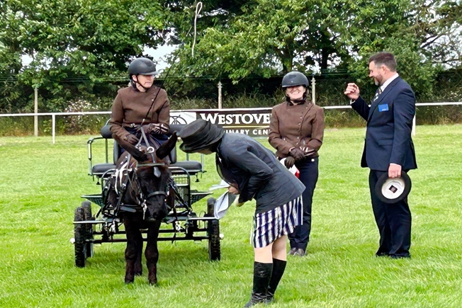 Royal Norfolk Commentator Sarah Dance talking to the donkey Burnbank Blackstar