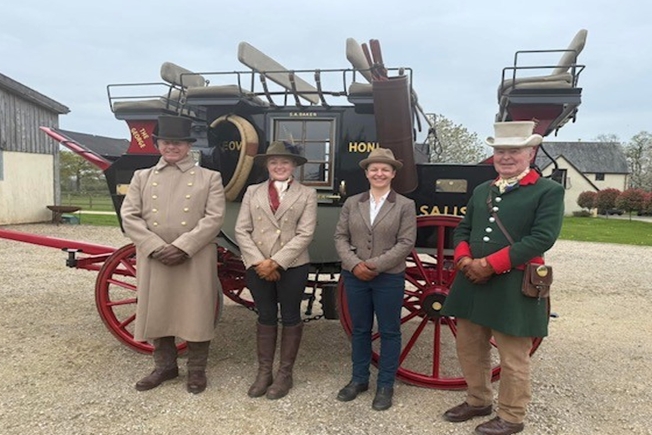 Mark Broadbent, Catherine West, Eleanor Wilson & Bob Elliott in front of the Millennium Road Coach - Coachmakers' Bursary April 2025